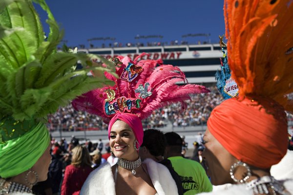 Porsha Revesz, center, and other showgirls help introduce the drivers ...