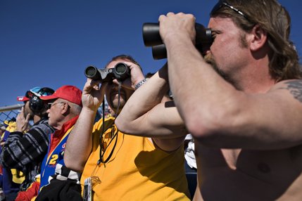 From the edge of the turn three seating, Cecil Boyce, from left, Jerry Haney, Sean Haney and Brandon Mirkay, all of Cross Junction, Va., count the NASCAR UAW-Dodge 400 auto race at Las Vegas Motor Speedway as one of their half dozen NASCAR races a year.