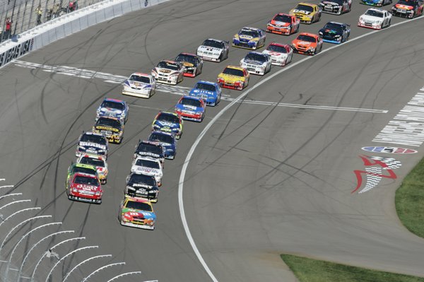Kyle Busch is at pole position, front right lane, as ...
