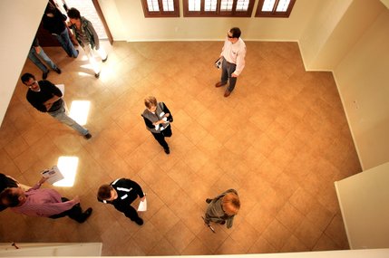 Prospective buyers check out a home for sale. The nine stops on the tour are like speed dating, with customers spending from five to 10 minutes at each house. The Zuckers warn buyers to beware of the damage some people cause to homes they are losing.
