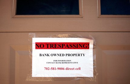 A sign on the garage door of the first home on the Feb. 23 Summerlin tour confirms its foreclosed-on status.