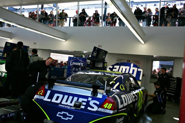 Spectators look in on Jimmie Johnson's Lowe's Racing car in ...