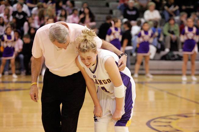 Durango High School coach Al La Rocque comforts his daughter Lindy La Rocque during the coach’s last home game in March 2008. He says he “never dreamed it would be so much fun” coaching Lindy and his other daughter, Ally, born 14 months apart.