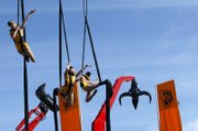 Aerialists perform Tuesday during the convention. The real stars of the show are big machines including backhoes, telehandlers, tower cranes and concrete crushers.