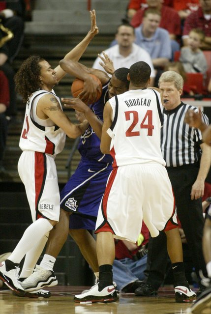 UNLV guards Curtis Terry, left, and Rene Rougeau pressure TCU forward Kevin Langford during their game Thursday, March 13, 2008 at the Mountain West Conference championships.  
