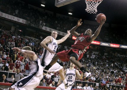 UNLV guard Wink Adams is fouled as he sails to the basket dring their 76-61 defeat of BYU in the Mountain West Conference championship game Saturday, March 15, 2008 at the Thomas & Mack Center.