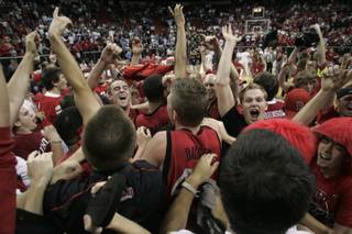 UNLV Rebels and fans celebrate their 76-61 defeat of BYU in the Mountain West Conference championship game Saturday, March 15, 2008 at the Thomas & Mack Center.