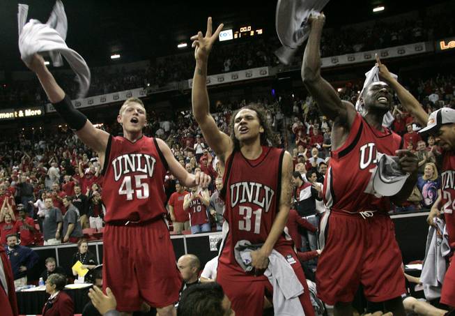 From left, UNLV's Joe Darger, Curtis Terry and Corey Bailey celebrate their 76-61 defeat of BYU in the Mountain West Conference championship game Saturday, March 15, 2008 at the Thomas &amp; Mack Center.