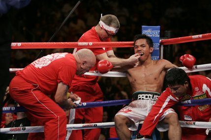 Manny Pacquiao is tended to between rounds during his fight against Juan Manuel Marquez. Pacquiao won by split decision. 