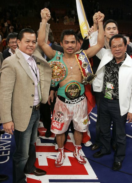 Manny Pacquiao added the WBC super featherweight title belt to his collection by beating Juan Manuel Marquez in a split decision.