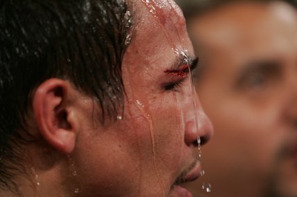 Juan Manuel Marquez waits in the ring after losing his WBC super featherweight title to Manny Pacquiao.