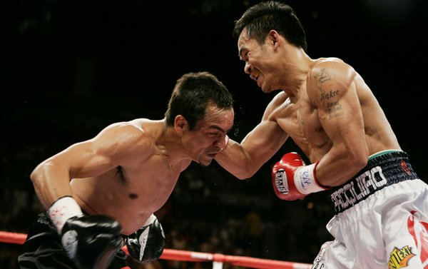 Manny Pacquiao lands a shot to champion Juan Manuel Marquez ...