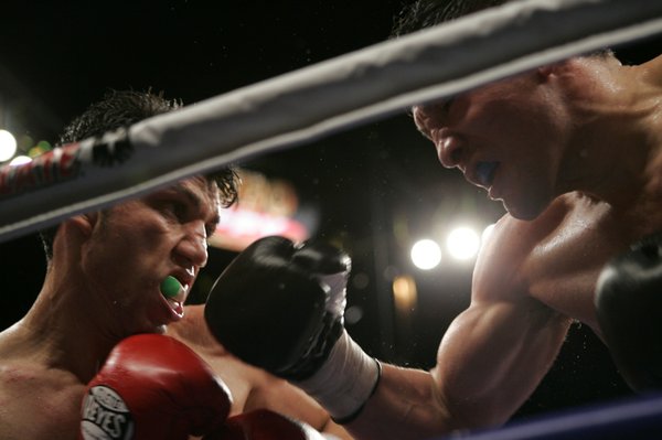 Lightweight boxers Ramon Montano, left, and David Diaz battle during ...