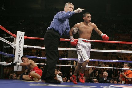 Referee Jay Nady, center, sends Abner Mares, right, of Mexico, to his corner after he knocked down Diosdado Gabi, of the Philippines, during their bantamweight fight.