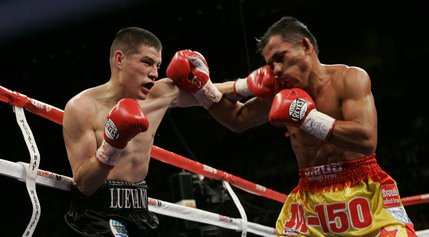 WBO featherweight champion Steven Luevano, left, of the U.S., connects a punch on Terdsak Jandaeng, of Thailand, during their title fight at the Mandalay Bay Events Center. Luevano won by unanimous decision.