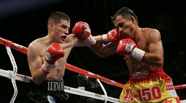 WBO featherweight champion Steven Luevano, left, of the U.S., connects ...