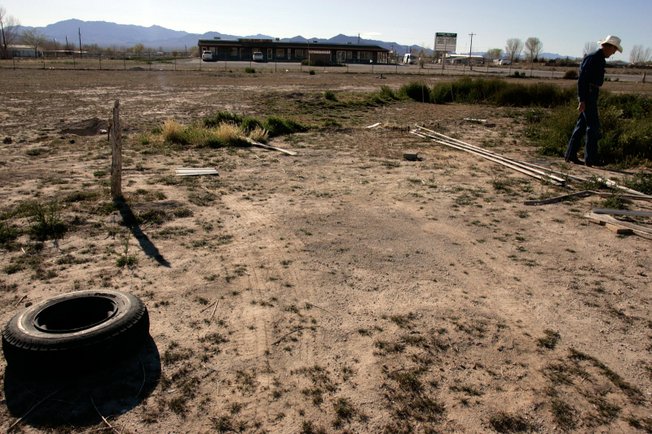 Robert Ringer walks on the site where a gas station could be built in Sandy Valley on Monday. Ringer is one of many residents who are opposed to plans for a gas station.