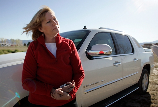 Sandy Valley resident Lana Haddad stands on the land she hopes to sell to a developer who wants to build a gas station there. Some residents worry a leak could taint their aquifer.