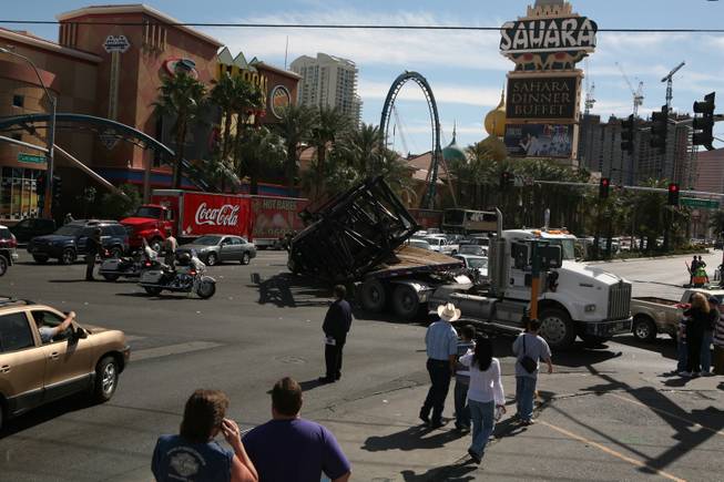 A construction crane toppled from a flatbed truck at one of the busiest intersections on the Las Vegas Strip at 1:30 p.m. Wednesday. Metro Police traffic officers responded to the intersection of Las Vegas Boulevard South and Sahara Avenue where the truck, making a left-hand turn onto westbound Sahara, lost its load, tying up traffic and the intersection. 