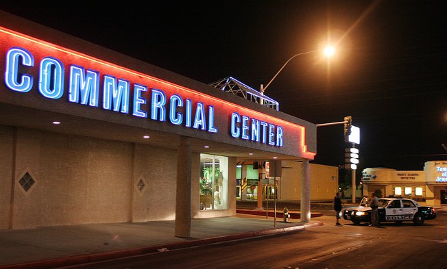 Metro Police officers question a man at the seedy Commercial Center on Sahara Avenue, where three buildings Clark County is looking to buy are located.
