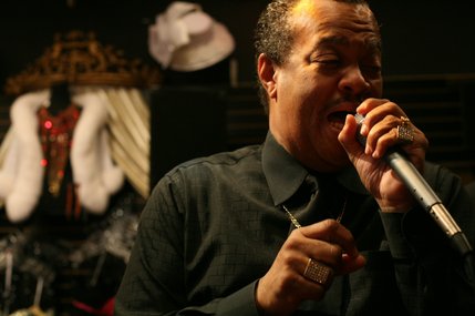 Derek David splits his time between singing at night and helping out in the store during the day