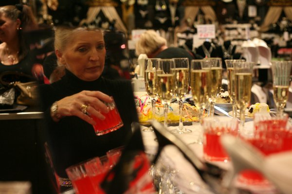 Rita Bliss David refreshes drinks at her shop. Bliss, a ...