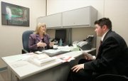 Bonnie Townsend, principal of Hal Smith Elementary School, interviews prospective teacher Brad Peck from Jackson Hole, Wyo., who likes the prospect of slower growth.