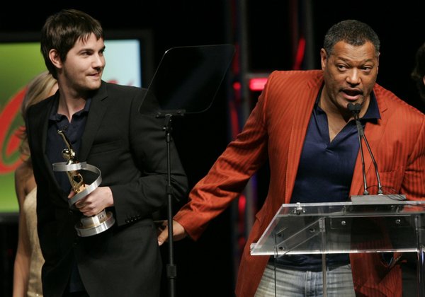 Jim Sturgess (L) listens to Laurence Fishburne as the actors, ...
