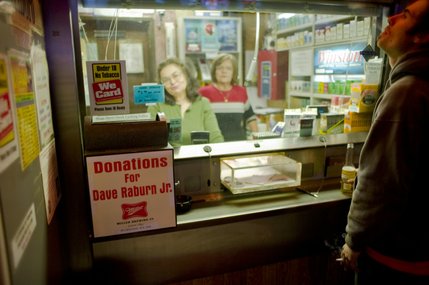 A donation box for David Rabun Jr.'s family was set up inside the Stage Door casino next to the check cashing counter. The Stage Door is known for supporting the ironworkers, and many of them frequent the bar after the day's work is over. 