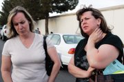 Simonne Purdy, left, and Monique Cole, sisters of Harold Billingsley, who died in October at the CityCenter site, talk outside the hall after the meeting.