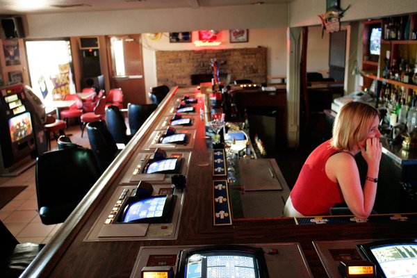 Erin Douthett has no customers to serve around 5 p.m. ...
