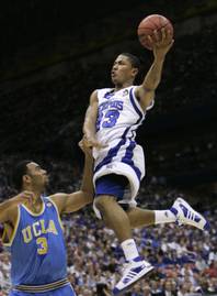 This April 5, 2008 file photo shows Memphis' Derrick Rose, right, shooting over UCLA's Josh Shipp (3) during the first half of a semifinal at the Final Four basketball tournament in San Antonio. 