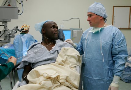 Joseph Kiwanuka listens to Dr. Thomas Kelly of Silver State Eye Care, after cataract surgery on his left eye in December. Kelly and the surgery center provided their services without charge. Kiwanuka later had his right eye done by Kelly and retina specialist Kwang Lee at Sunrise Hospital. The surgery on the right eye has more difficult due to a previous operation that fixed a detached retina.