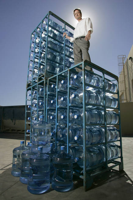  J.C. Davis, spokesman for the Southern Nevada Water Authority, poses with 265 gallons of water  - the approximate per capita daily water usage in the Las Vegas Valley. 