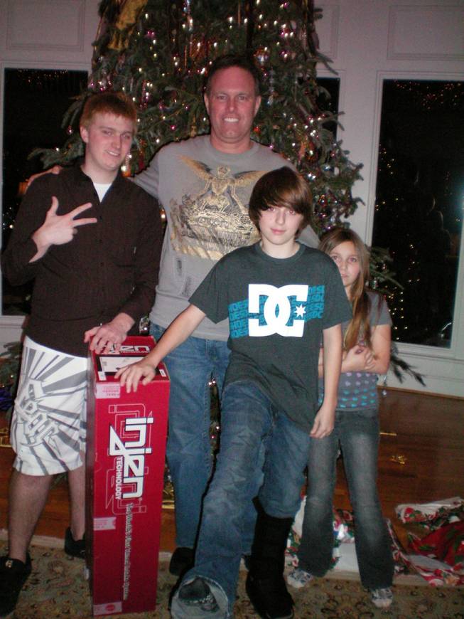 Herbert is shown on Christmas with, from left, Jon, James and Jessica.
