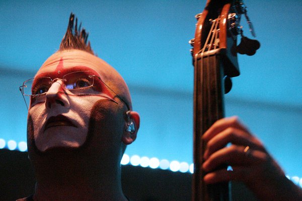 Derek Jones plays the bass live in a studio beneath ...