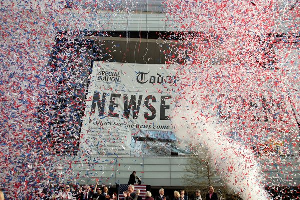 Confetti flies as the Newseum officially opens on Pennsylvania Avenue ...