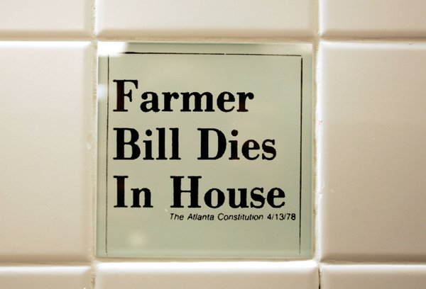 Tiles in the women's bathroom highlight headline bloopers from newspapers ...