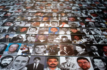 Photographs of journalists killed while on assignment cover a wall at the Journalists Memorial.