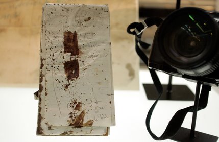 TIME senior correspondent Michael Weisskopf's blood-stained notebook from when he lost his hand in Iraq is on display at the Newseum on opening day. 