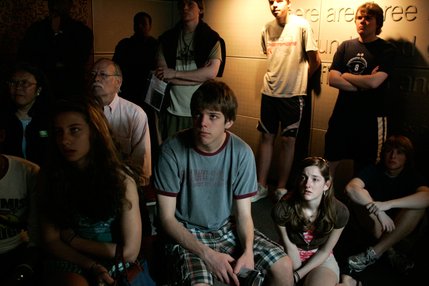 Visitors watch a video about journalists covering the terrorist attacks inside the 9/11 Gallery at the Newseum.