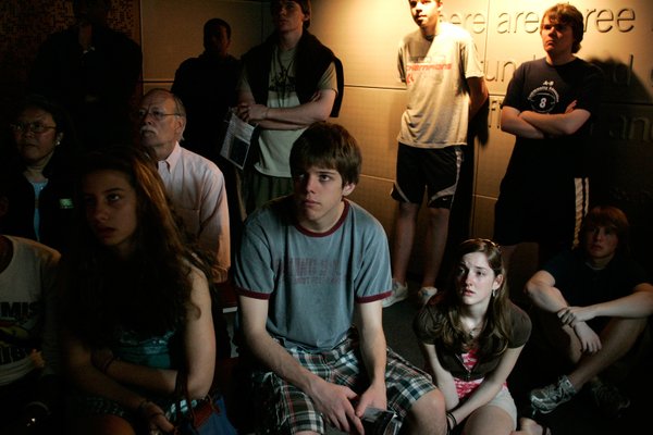 Visitors watch a video about journalists covering the terrorist attacks ...