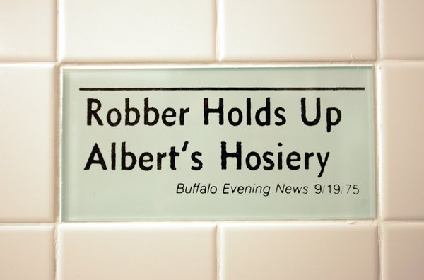 Tiles in the women's bathroom highlight headline bloopers from newspapers ...