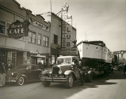 A truck tows a big boat down Fremont Street in front of the Oasis Cafe and the Frontier Club. Originally called the Fortune Club, the Frontier Club later became the Lucky Strike -- which was famous for its cheesy sci-fi looking sign.