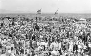 A large crowd celebrates the completion of the railroad at Boulder Junction (near the Hoover Dam) on Sept. 17, 1930. Work on the dam began in 1931. Dam workers were forced to stay in tents because Boulder City had not been completely built. That, combined with poor working conditions, led to a strike in 1931.  The strike was soon quelled, and by 1932 Boulder City was established.