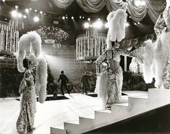 A backstage view of one of Las Vegas' spectacular shows that features lavish outfit and headdress-wearing showgirls. Despite their waning popularity, showgirls are still a treasured part of Las Vegas history.
