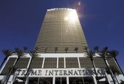 Trump's latest luxury property rises 64 stories over the Strip. A restaurant in the 1,282-suite tower is simply named DJT, his initials. Developers, real estate agents, politicians and beauty queens helped the Donald fete the opening.