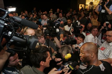 Boxer Bernard Hopkins (bottom right) is surrounded by reporters and photographers before a public workout at Planet Hollywood Tuesday April 15, 2008.