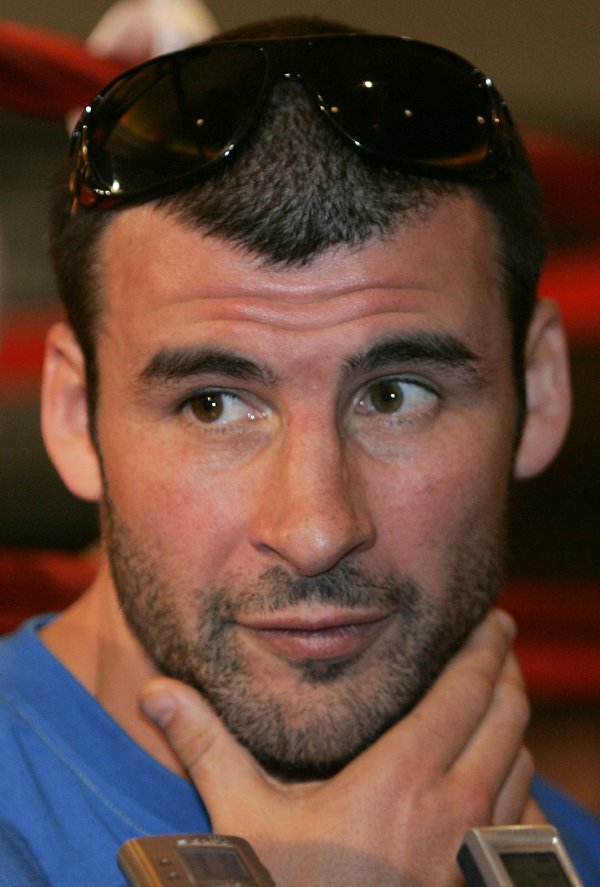 Boxer Joe Calzaghe of Wales listens to a question from ...