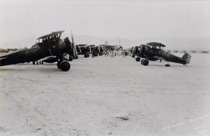 Two rows of biplanes line Las Vegas' Alamo airport in the late 1940s. The airport was established in 1942 by aviator George Crockett. In 1948 the airstrip was purchased by Clark County and was named Clark County Public Airport.  Just a few months later it was renamed again -- this time as McCarran Field
